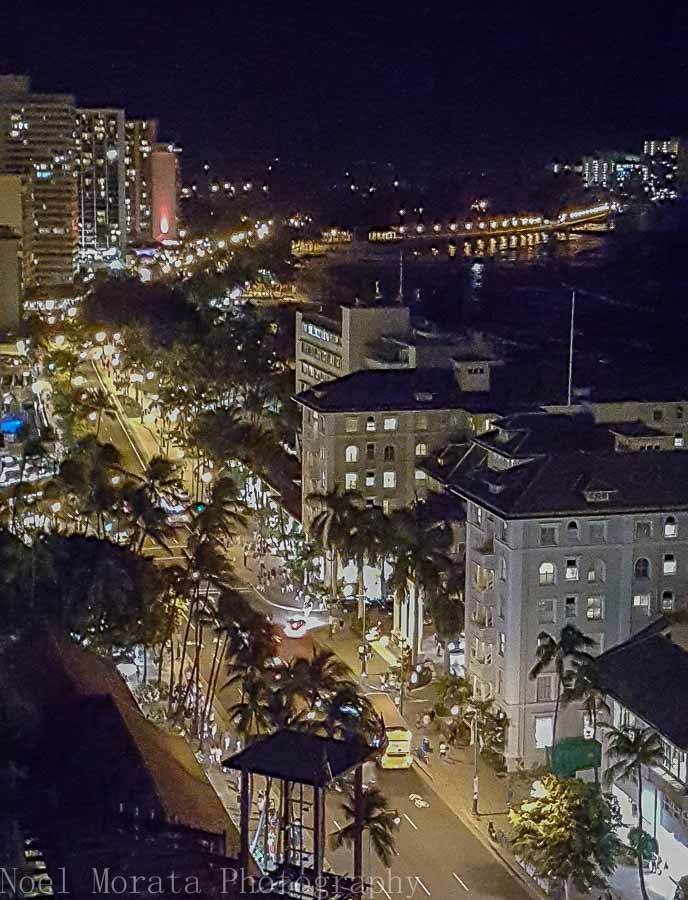 Enjoy the nighttime scene along Waikiki Beach area