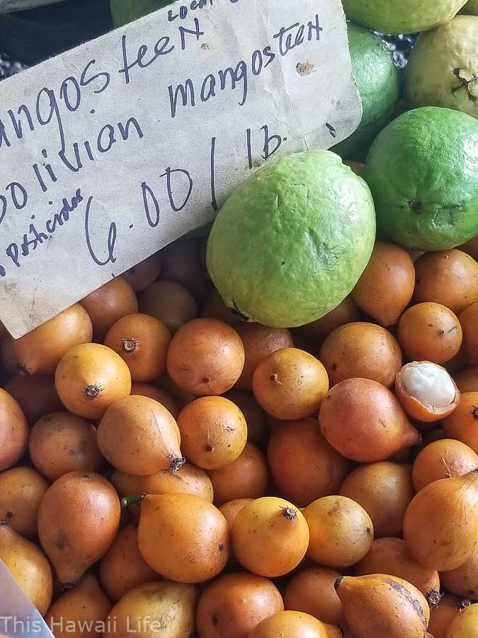 Mangosteen and guavas for sale at the market