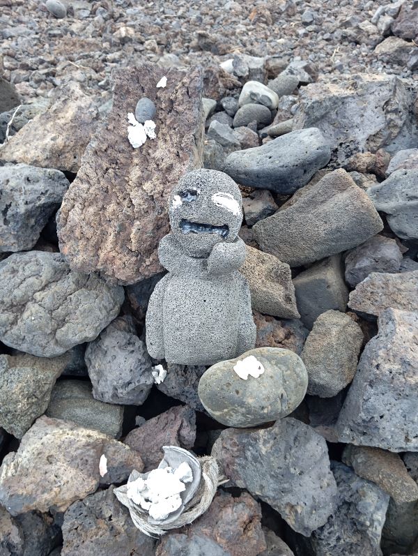 A tiki god placed at the crescent shaped rock groupings in the middle of the heiau